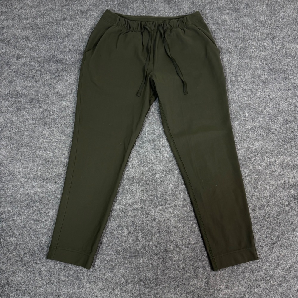 Lululemon On the Fly 7/8 Pant Woven Dark Olive Green Womens Size 6 EUC